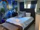 Bedroom with king-size bed and Avatar-themed decor at 115 Essex Pl, Davenport, FL 33896