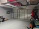 Spacious garage with overhead storage and room for bikes at 115 Essex Pl, Davenport, FL 33896