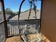 Screened balcony with a hanging chair and backyard views at 115 Essex Pl, Davenport, FL 33896