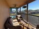 Relaxing screened balcony with wicker furniture and neighborhood views at 115 Essex Pl, Davenport, FL 33896