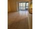 Living room with tile floors and access to a balcony at 1174 Paseo Del Mar # D # 32707, Casselberry, FL 32707