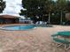 Community pool with picnic tables and lake view at 1174 Paseo Del Mar # D # 32707, Casselberry, FL 32707