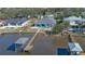 Aerial view of a waterfront home with private dock and pool at 118 River Ln, Ormond Beach, FL 32176