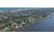 Aerial view of waterfront homes with private docks and a beautiful ocean at 118 River Ln, Ormond Beach, FL 32176