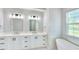 Spa-like bathroom with a freestanding tub and double vanity at 118 River Ln, Ormond Beach, FL 32176