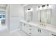 Elegant bathroom with double vanity and quartz countertop at 118 River Ln, Ormond Beach, FL 32176