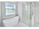 Clean bathroom with walk in shower and soaking tub at 118 River Ln, Ormond Beach, FL 32176