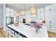 Modern kitchen featuring white cabinets and a large island at 118 River Ln, Ormond Beach, FL 32176