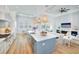 Modern kitchen with a light blue island and white cabinets at 118 River Ln, Ormond Beach, FL 32176