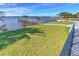 Expansive waterfront lawn with private dock access at 118 River Ln, Ormond Beach, FL 32176