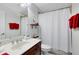 Bathroom with tub, shower, and dark wood vanity at 13132 Coldwater Loop, Clermont, FL 34711