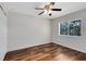 Bedroom featuring hardwood flooring, ceiling fan, closet and natural light at 13132 Coldwater Loop, Clermont, FL 34711