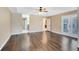 Large bedroom featuring wood floors, ceiling fan, and french doors at 13132 Coldwater Loop, Clermont, FL 34711