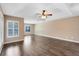 Spacious bedroom with tray ceiling, hardwood floors, and lots of natural light at 13132 Coldwater Loop, Clermont, FL 34711