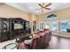 Inviting living room featuring hardwood floors, a ceiling fan, and a view of the pool at 13132 Coldwater Loop, Clermont, FL 34711