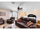 Recreation room with leather couches and a ceiling fan at 13132 Coldwater Loop, Clermont, FL 34711