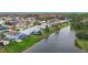 Aerial view showcasing the home's backyard pool and lakefront access at 13656 Crystal River Dr, Orlando, FL 32828