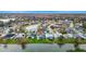 Aerial view showing home's location in a neighborhood with a lake at 13656 Crystal River Dr, Orlando, FL 32828