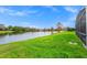 Landscaped backyard with lake view at 13656 Crystal River Dr, Orlando, FL 32828