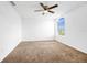 Bright bedroom with large window and ceiling fan at 13656 Crystal River Dr, Orlando, FL 32828