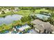 Community pool with lounge chairs and a clubhouse at 13656 Crystal River Dr, Orlando, FL 32828