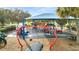 playground with swings and play structures at 13656 Crystal River Dr, Orlando, FL 32828