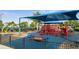 Community playground with shade structure at 13656 Crystal River Dr, Orlando, FL 32828