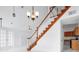 Wooden staircase with white railings in a two-story house at 13656 Crystal River Dr, Orlando, FL 32828