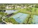 Community tennis courts with covered seating areas at 13656 Crystal River Dr, Orlando, FL 32828