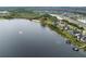 Aerial view highlighting lakefront homes and the beautiful shoreline at 14415 Lake Huckleberry Ln, Winter Garden, FL 34787