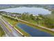 Aerial view showing a large lakefront lot near other houses at 14415 Lake Huckleberry Ln, Winter Garden, FL 34787