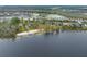 Aerial view of lakefront community with homes and private beach access at 14415 Lake Huckleberry Ln, Winter Garden, FL 34787