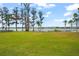 Expansive backyard leading to the waterfront, a nature lover's paradise at 14415 Lake Huckleberry Ln, Winter Garden, FL 34787