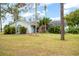 Charming single-story home features a well-manicured lawn and lush landscaping, perfect for serene living at 14415 Lake Huckleberry Ln, Winter Garden, FL 34787