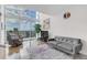 Living room with hardwood floors and city views at 150 E Robinson St # 1410, Orlando, FL 32801