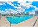 Large rooftop pool with city views and lounge chairs at 150 E Robinson St # 1410, Orlando, FL 32801