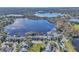 Aerial view of lakefront community with pool and lush landscaping at 174 Northshore Cir, Casselberry, FL 32707