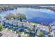 Aerial view of townhouses near lake, showcasing waterfront location and community at 174 Northshore Cir, Casselberry, FL 32707