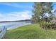 Landscaped backyard with lake view and lush greenery at 174 Northshore Cir, Casselberry, FL 32707