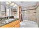 Bathroom with granite vanity and tiled shower/tub combo at 174 Northshore Cir, Casselberry, FL 32707