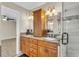 Spacious bathroom with double sinks, granite countertop, and a view into another room at 174 Northshore Cir, Casselberry, FL 32707