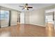 Bright and airy bedroom with wood flooring, ceiling fan, and access to loft at 174 Northshore Cir, Casselberry, FL 32707