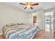 Main bedroom with access to bathroom and lake view at 174 Northshore Cir, Casselberry, FL 32707