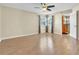 Large bedroom with wood flooring, ceiling fan, and access to bathroom at 174 Northshore Cir, Casselberry, FL 32707