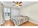 Bright bedroom with wood floors and double door closet at 174 Northshore Cir, Casselberry, FL 32707