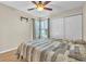 Bedroom featuring wood floors, plantation shutters and ceiling fan at 174 Northshore Cir, Casselberry, FL 32707