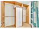 Basic closet with double hanging rods and additional storage at 174 Northshore Cir, Casselberry, FL 32707