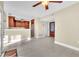 Open living space with tile floors, kitchen and entry access at 174 Northshore Cir, Casselberry, FL 32707