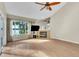 Living room with vaulted ceiling, fireplace, and lake view at 174 Northshore Cir, Casselberry, FL 32707