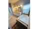 Bathroom with double sinks and a large soaking tub at 196 Westmoreland Cir, Kissimmee, FL 34744